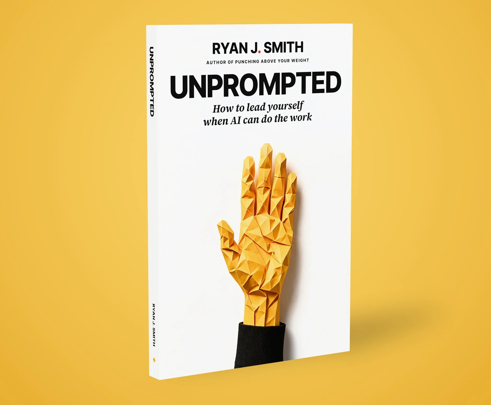 The Unprompted paperback standing on a field of yellow, a yellow paper hand raised on its cover